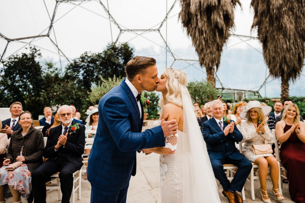 Bride and Groom kiss in the Eden Project