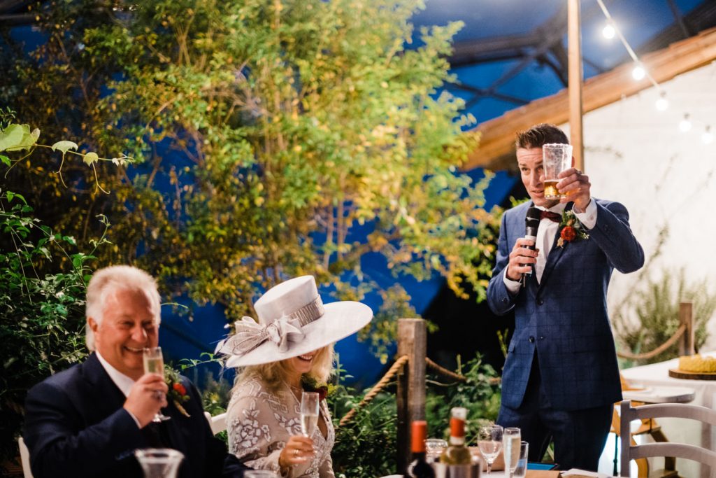 Best man gives a toast to the bride and groom.