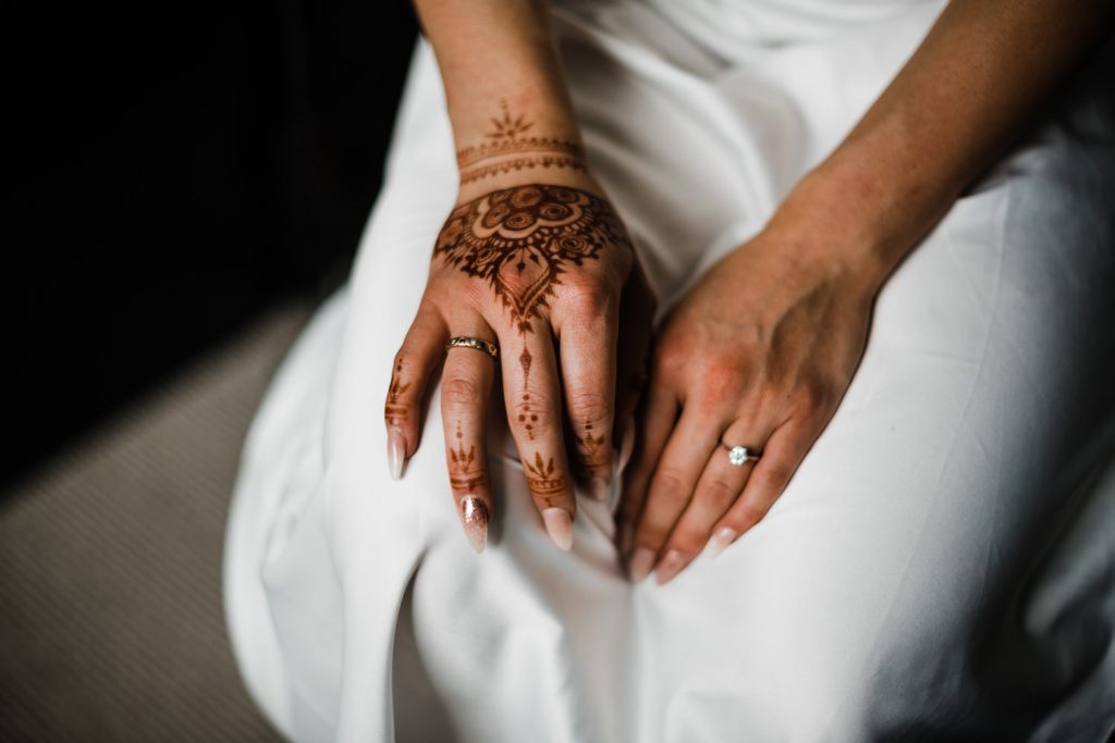 Bridal hands painted with henna.