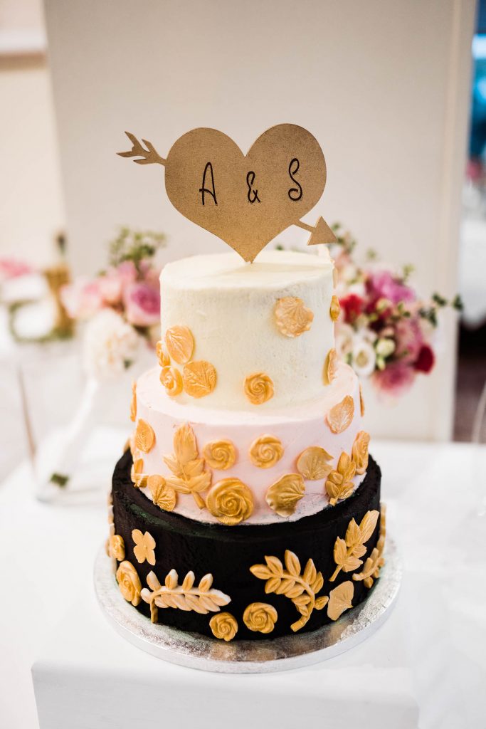 Wedding cake with 'A&S' cake topper.