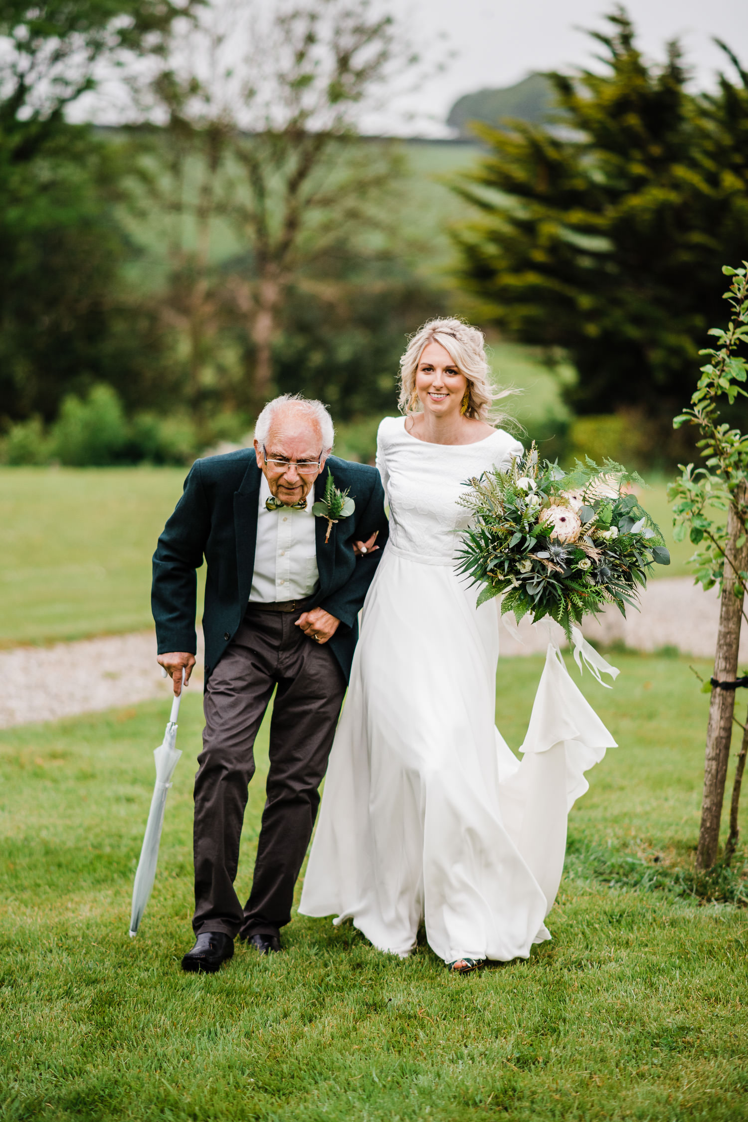 Bride's grandfather walks her down the aisle.