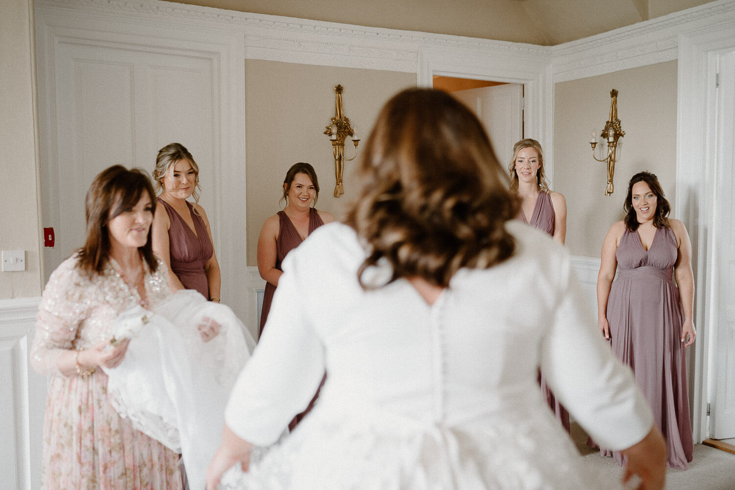 Bridesmaids get their first look of bride Emily at Kingston Estate.